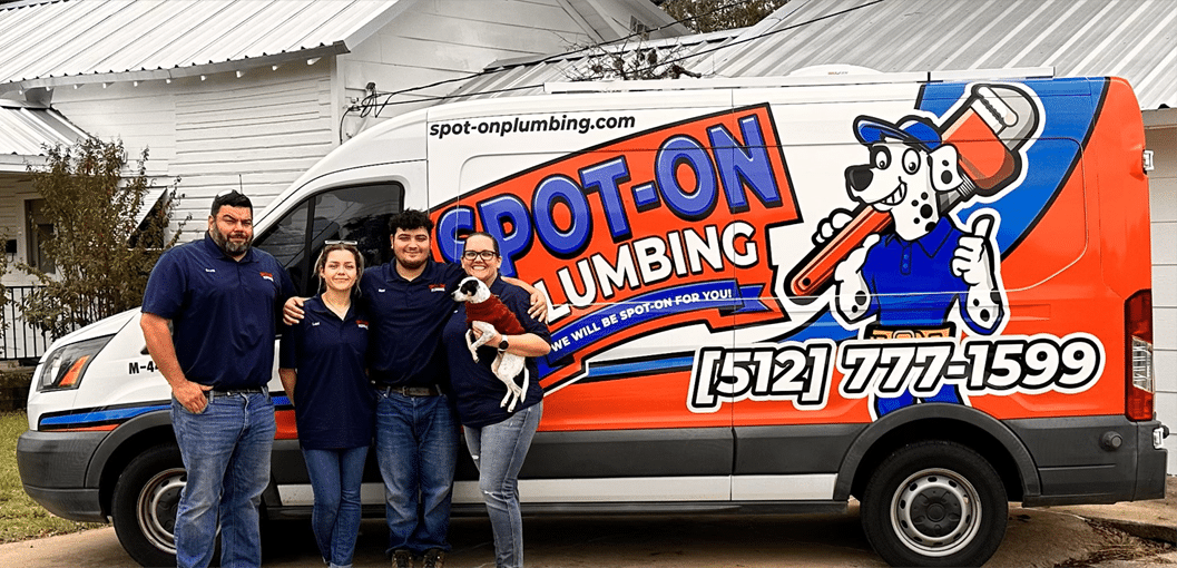 Spot-On Plumbing crew/family in front of their company van.