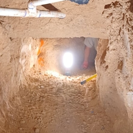 Inside a plumbing tunnel.