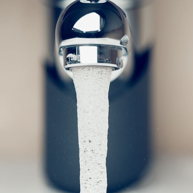 Water flowing out of a faucet